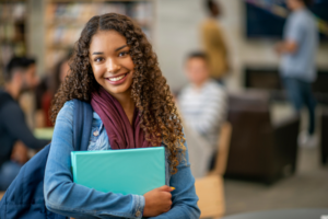 Student holding a binder